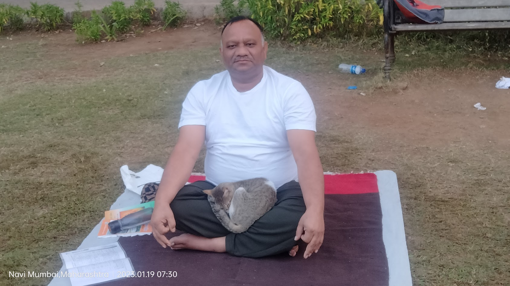 Sandeep Vyapari sitting calmly during outdoor yoga practice